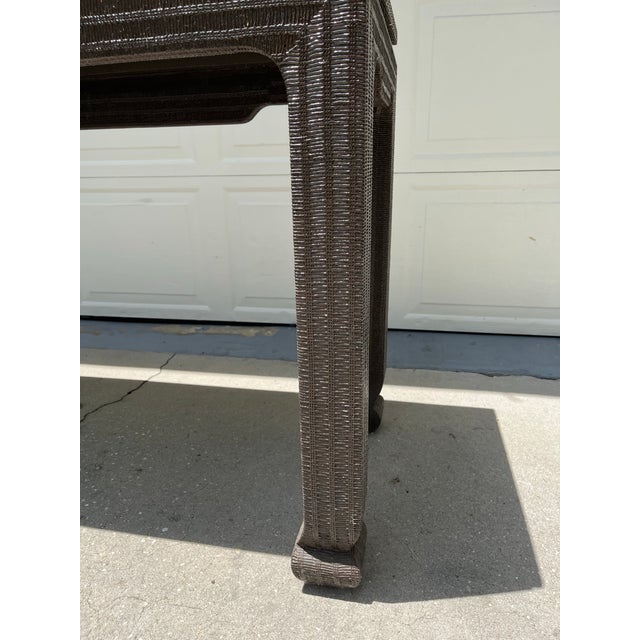 Vintage extra large brown Ming style console table. It is lacquered over a textured grasscloth. Very sturdy and well built.