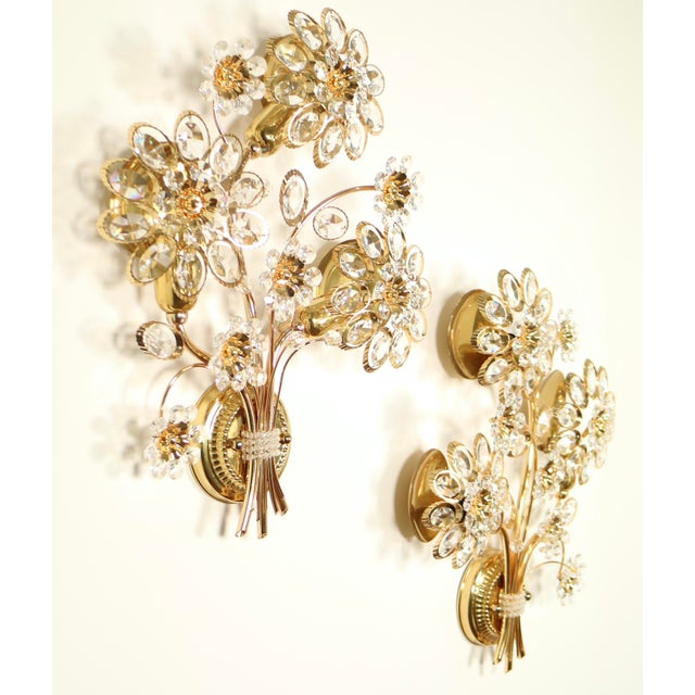 Set of two Palwa light sconces , late 70's , made with Swarovski crystals and 24k gold plated body , matching pair