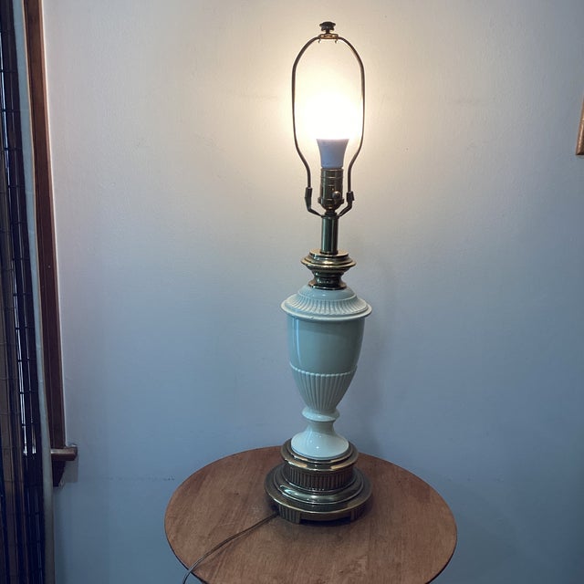 The Vintage Rare Ethan Allen Art Deco Brass and Enamel Urn Table Lamp with a footed base is a luxurious and unique piece...