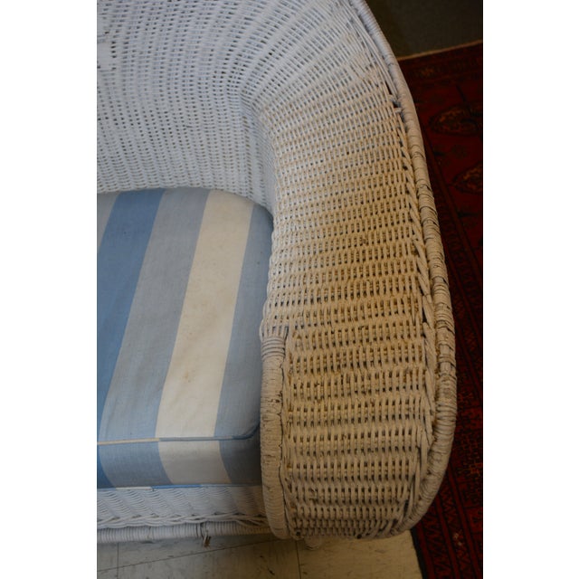 This is a great, unique looking, wicker arm chair! Well loved. Solid & sturdy overall. Cushion has a zip & is slightly...