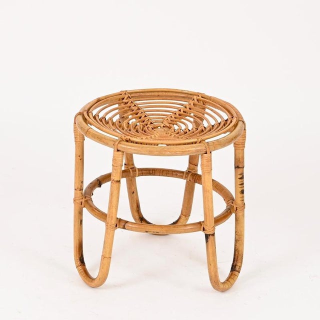 Gorgeous Mid-Century organic pouf or side table fully made of curved rattan and hand-woven wicker. This stylish French...