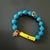 The Evil Eye & Elephant Turquoise Stone Beaded Bracelet is a one-of-a-kind piece of handmade jewelry that combines natural...
