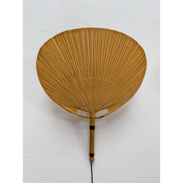 Beautiful pair of iconic uchiwa iii wall lamps, designed by ingo maurer for m-design, germany, in 1973. inspired by...
