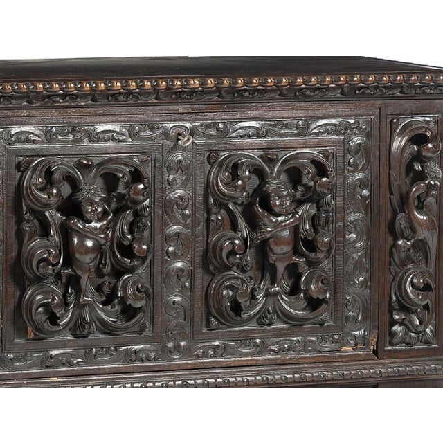 Renaissance-style chest. Portuguese, early 20th century; made of chestnut wood; depicting vegetal and floral motifs; lion-...