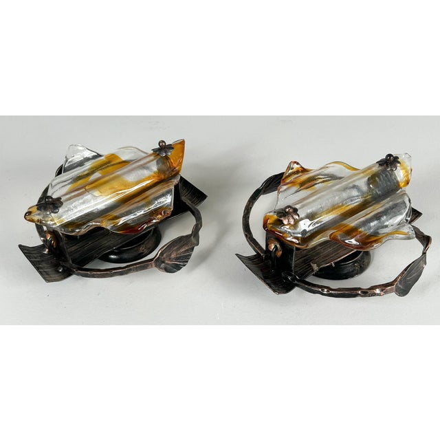 Brutalist wall lights/wall lamps, Germany, 1970s, solid construction made of iron and Murano glass. Dimensions approx.: H....