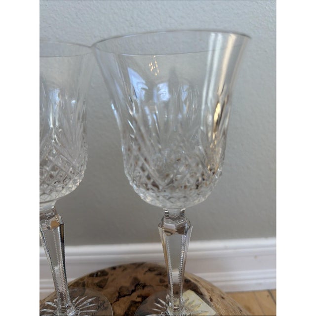 Still have labels. The product is a set of two Wedgwood Royal Crystal Wine Glasses in the MAJESTY Pattern, standing at 7...