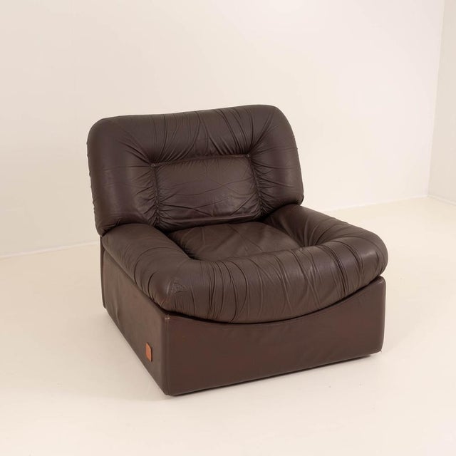 Two repaired areas: one on a front corner and one on the rear of the backrest. Both repairs are structurally sound and...