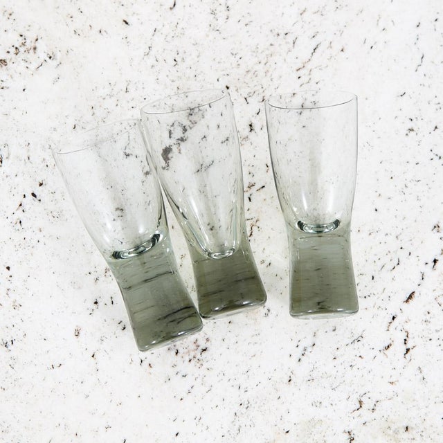 Lot of 3 smoked grey shot glasses by Per Lutken for Holmegaard . We obtained these from a 1960s estate and these sat...