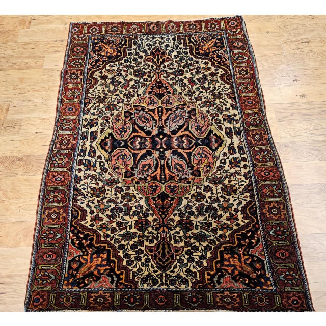 "A beautiful late 19th century Persian Farahan Sarouk area rug, masterfully woven with a refined floral design of...