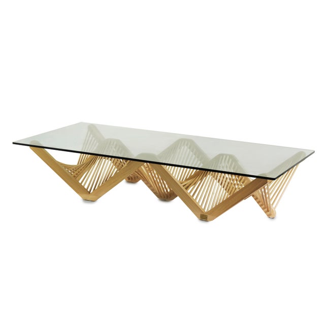 A bold web of geometric shapes marks this Geo Rectangular Coffee Table, a striking design by Vito Selma that turns a...
