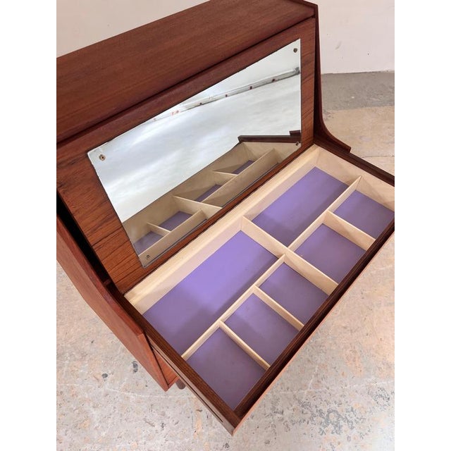 This Danish secretary desk from the 1960s is a true marvel of mid-century design. It combines two pieces of furniture in...