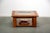 Compact coffee table made from walnut burl veneer with a glas top. The table features a useful shelf that make it...