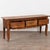 19th century French console table, crafted in cherry with three drawers across the front, each fitted with a large brass...