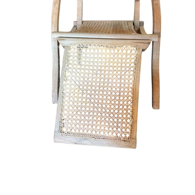 Early 20th century French teak-wood and woven cane steamer recliner armchair, the whole armchair including the foot stool...