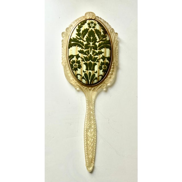 A lovely hand mirror with all the right looks, however, made of materials that aren't top quality. The piece is made of...