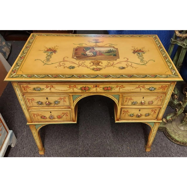 Exquisite early 19th century paint decorated kneehole desk that is d3corated on three sides and the top. It does have some...