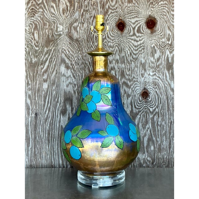 This stunning vintage églomisé table lamp exudes bohemian charm with its captivating hand-painted design and iridescent...