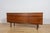 This mid-century sideboard in teak was produced in Great Britain by White & Newton in the 1960s. The sideboard has...