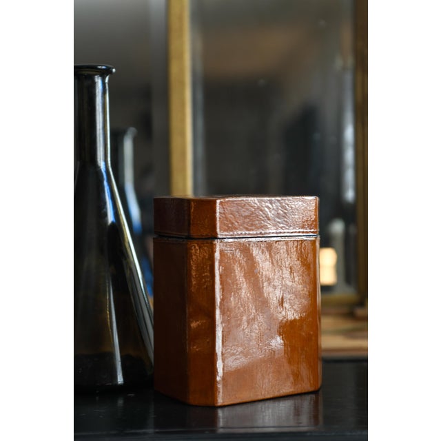 This is a listing for the lacquered tall brown box only. It is a tea caddy shaped octagon 6" high and 5" wide and 3.5"...