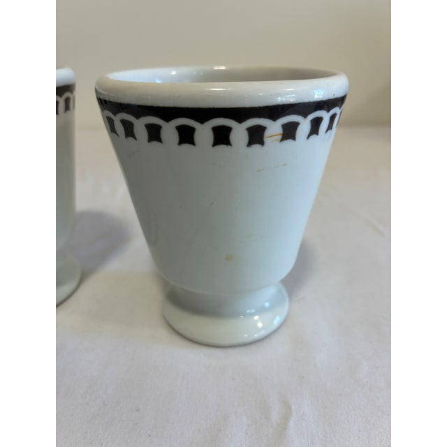 A charming set of 2 vintage finds pedestal mugs by Sterling Vitrified China, East Liverpool, Ohio. Each features a footed...