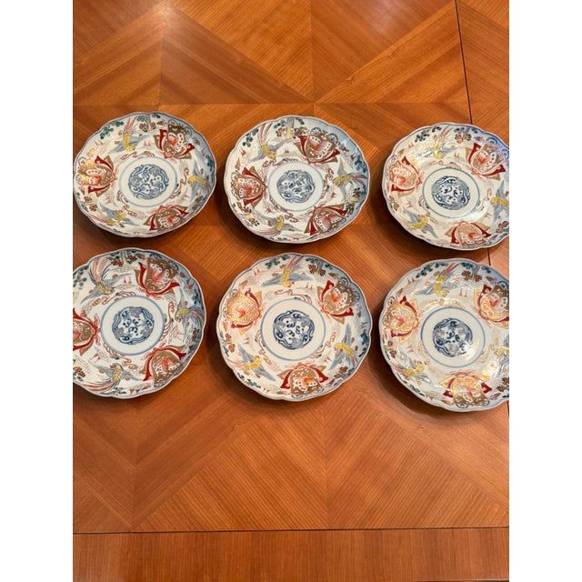 Beautiful Set of 6 Japanese Imari porcelain plates with stunning colors including blues, red, yellow and gold.