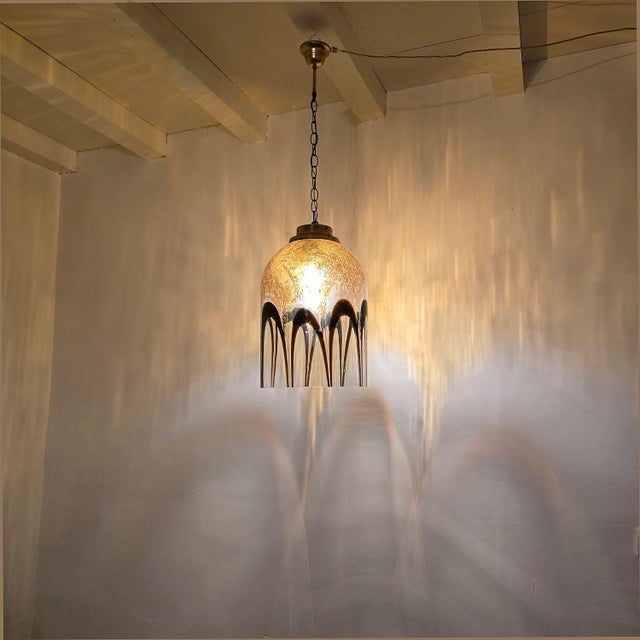 Warm colors Mid Century Modern Murano glass pendant chandelier, attributed to Mazzega Italy 1970s. The chandelier is made...