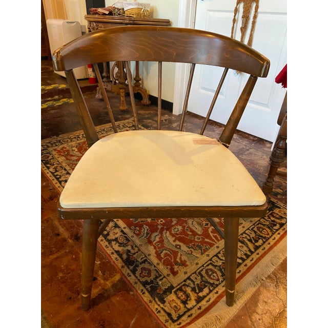 1920's brown wood chairs with faux leather seats by Authentic Furniture Products from El Segundo, California. The chairs...