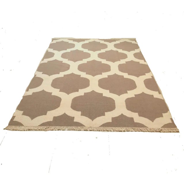 This hand-woven rug was produced in India in the 1980s. It has never been used.