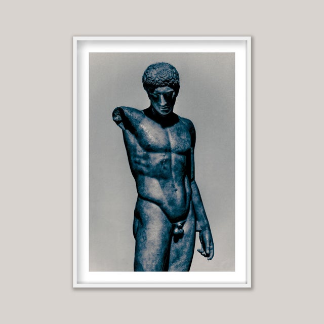 The Dark Roman, a blue and sepia-toned black-and-white photograph of a Roman sculpture, itself a copy of an original Greek...