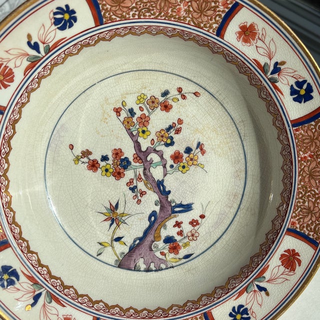 Antique English hand-painted porcelain bowl with floral decoration and gilt edge. Elegant form and finely detailed surface...