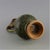 This striking ceramic ewer is a captivating decorative piece, inspired by traditional Chinese pottery and featuring a...