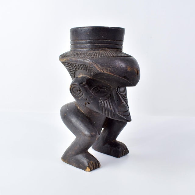 The Kuba people of the Democratic Republic of the Congo are renowned for their intricate figurative carvings, notably seen...