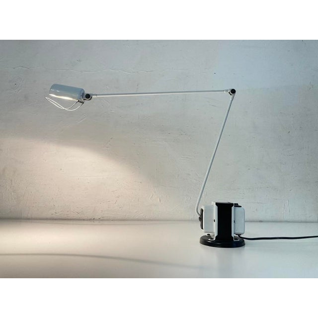 One table lamp from the 1980s, adjustable in multiple positions, single-bulb halogen socket, two light intensities. Model...