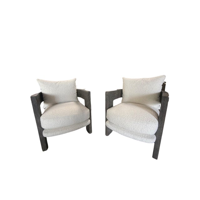The Bernhardt Renny Chair makes a bold design statement with its striking contrast of plush upholstery and architectural...