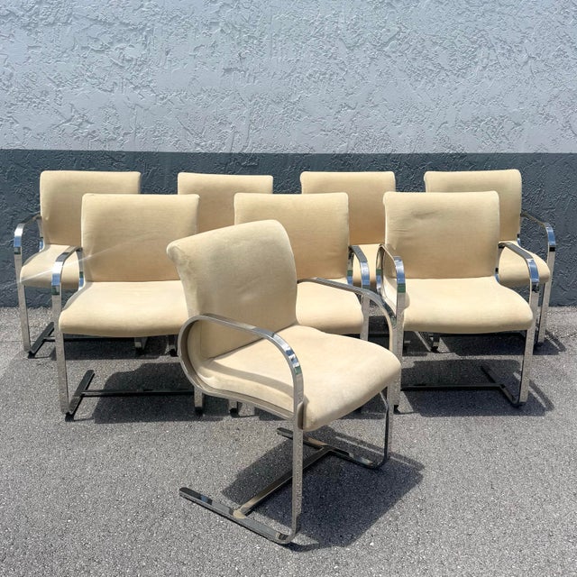 A striking set of Brno-style cantilever dining chairs inspired by the iconic designs of Mies van der Rohe, embodying the...