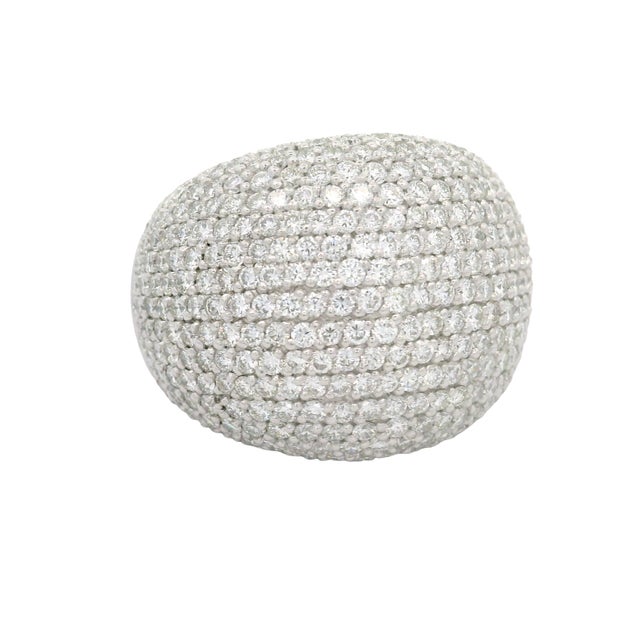 A captivating cocktail ring adorned with 5.16 carats of round white diamonds. The diamonds are meticulously set to create...