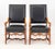 Pair of Louis XIV Style Walnut Fauteuil, with riveted black leather upholstery on four carved wood legs conjoined by...