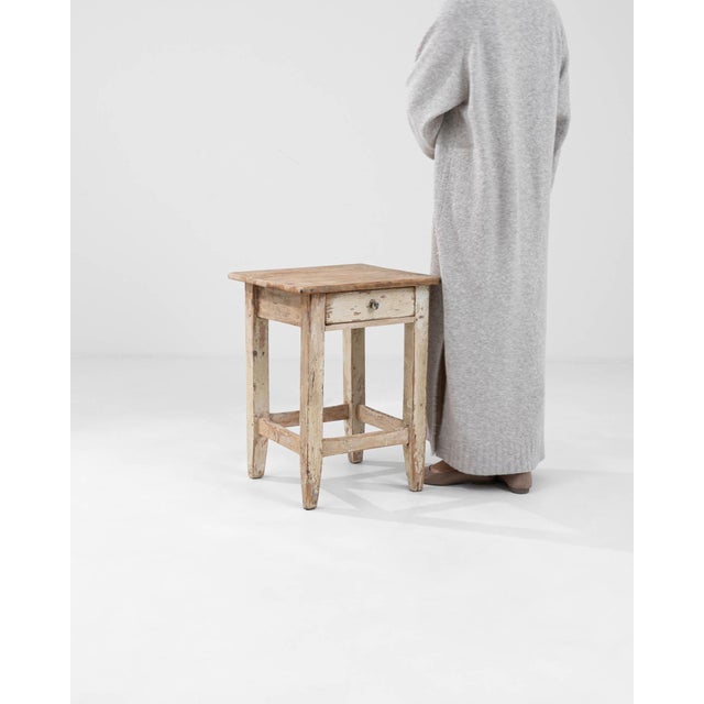 Introducing our exquisite 1900s Central European Wooden Stool, a charming piece that seamlessly blends functionality with...