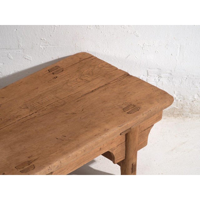 Antique low table in pine wood, traditional Chinese furniture originating from northern China and dated circa 1930....