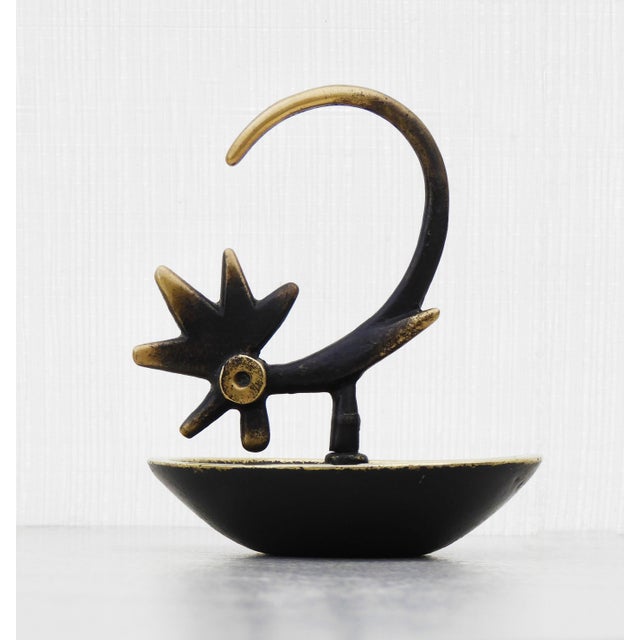 Walter Bosse Rooster Ring Catcher/Ashtray, Vienna, c. 1950s A rare rooster ring catcher/ashtray in solid blackened brass,...