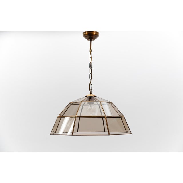 Lovely brass and smoked glass ceiling lamp, italy, 1960s. the currently set height of the lamp is 60 cm. The height can be...