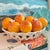 Large ceramic basket full of oranges and orange blossoms made in Spain by Casa Pupo.