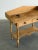 W42 D18 H39 This antique solid pine console table features two small drawers with wooden knobs, and delicate turned legs....