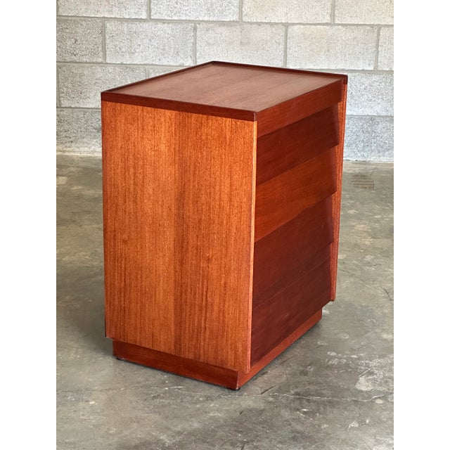 Small chest of drawers, consisting of louvered walnut fronts and mahogany case. Five drawers total with the top being...