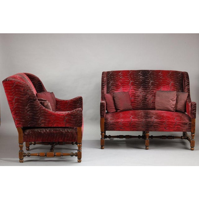 Pair of louis xiii style sofas, late 19th - early 20th century. Their silhouette is generous and enveloping, with a deep...