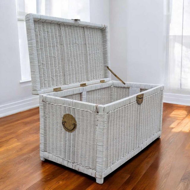 Vintage White Wicker Storage Trunk with Brass Hardware. A vintage woven wicker storage trunk in a painted white finish...