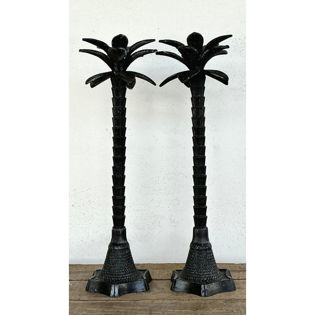 Elevate your interior with this striking pair of monumental palm tree candlesticks, embodying the peak of Hollywood...