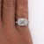 Lab-grown east-west set 5.32 carat emerald cut diamond in half bezel setting with white diamond accents in 14K white gold...
