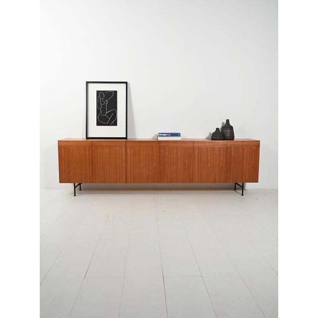 Attributed to Nils Jonsson, produced in the 1950s and 1960s: minimalist lines, groove handles, orchestrated grain, and...