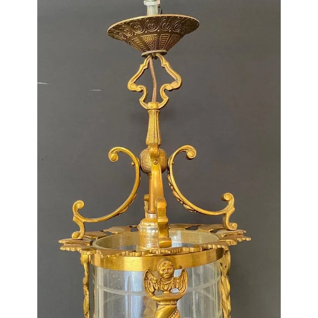 An exceptional Spanish neoclassical revival style lantern or pendant. The pendant is hand crafted of gilt iron in a...